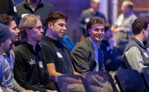 UNE students watch a panel discussion in Innovation Hall